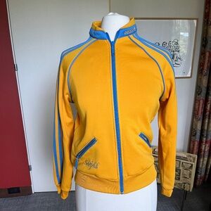 Vintage Adidas Woman's Jacket in yellow with blue trim.